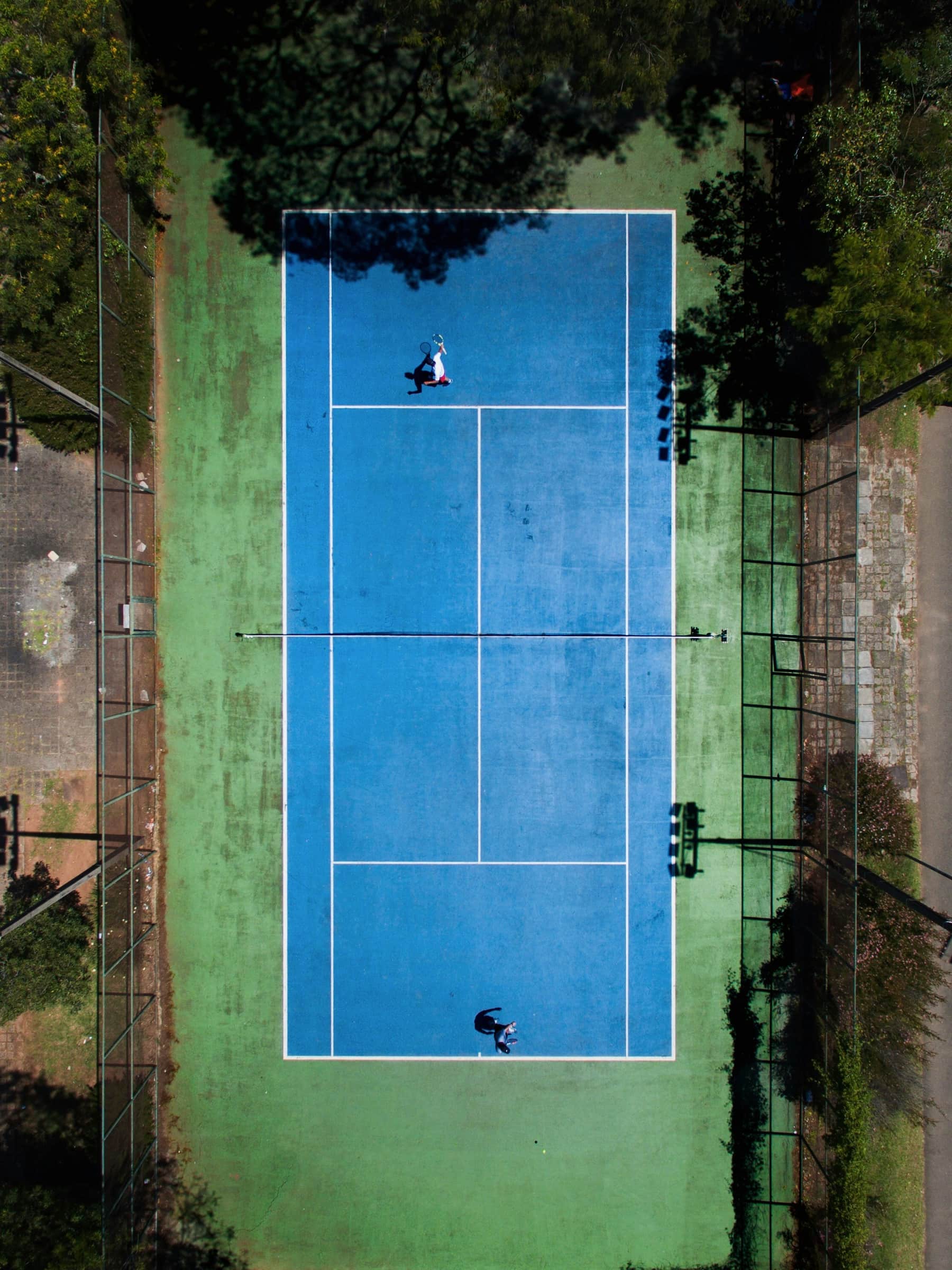 Padel racket and balls on a neutral studio background